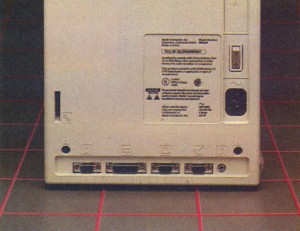 The rear of the Mac. Note the icon labels. The bottom row of connectors is for (from left) the mouse, second floppy disk, printer, modem and speaker.