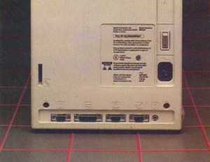 The rear of the Mac. Note the icon labels. The bottom row of connectors is for (from left) the mouse, second floppy disk, printer, modem and speaker.