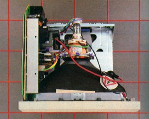 The top of the Mac with the cover removed. The disk drive and digital circuitry are below the cathode-ray tube; the analog circuitry is to its left