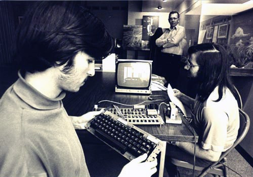 Steve Jobs and Steve Wozniak using Apple 1 computer system, ca. 1976